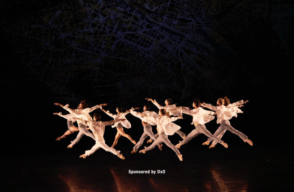 A troupe of dancers on a stage.
